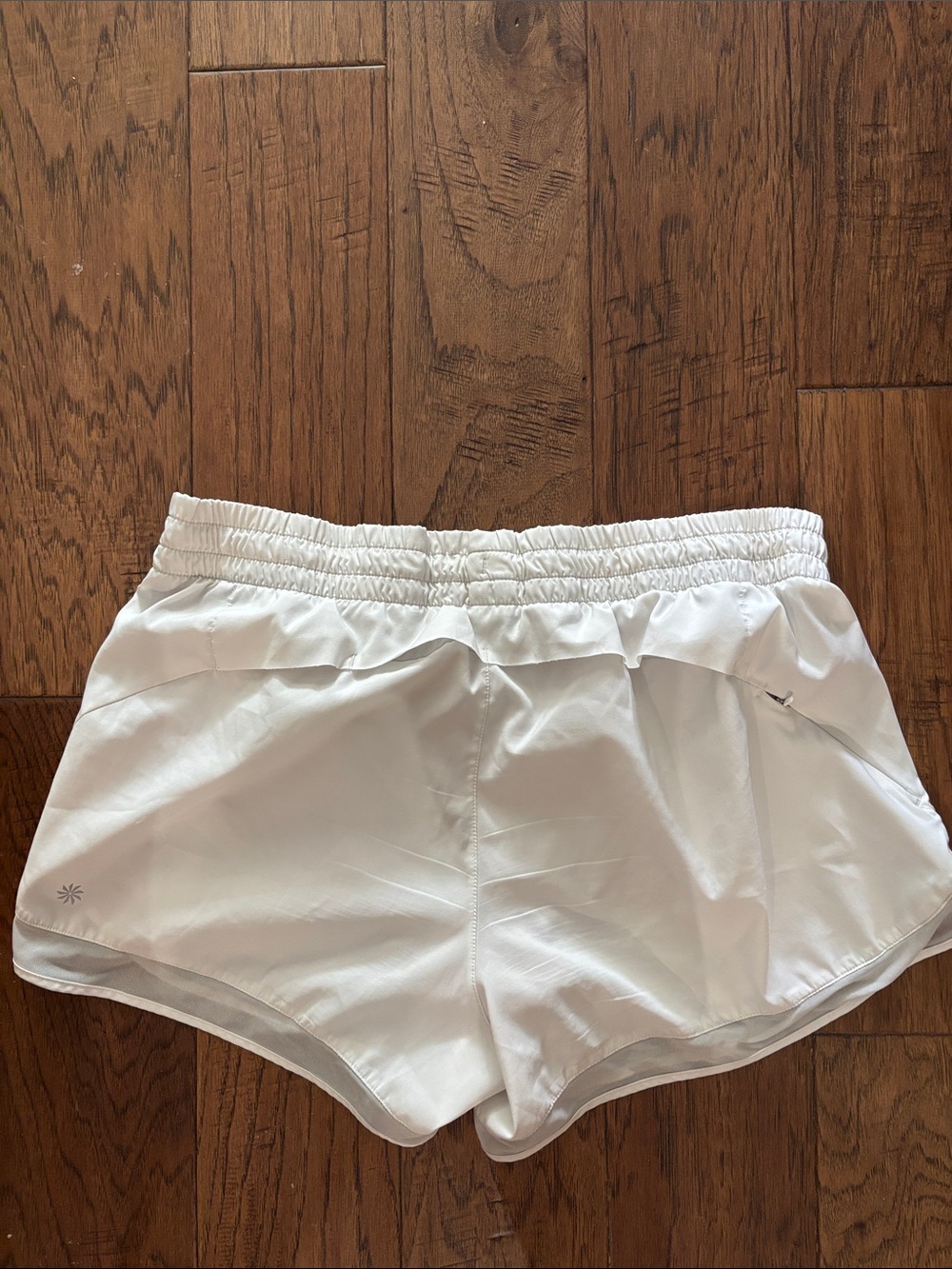 NWOT Athleta white running shorts with flesh lining